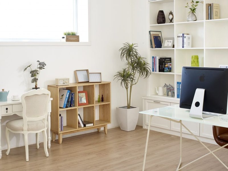 desk in bedroom with light furniture