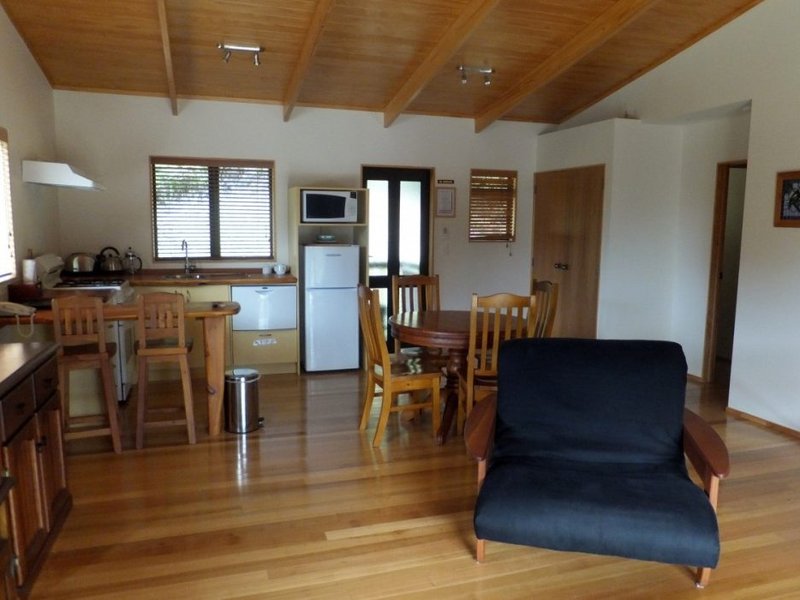 living room and kitchen with lounge chair